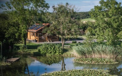 Wooden cottage for 6 people located on the edge of a private pond.