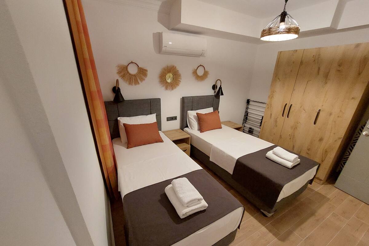 Economy Apartment, Ground Floor | In-room safe, desk, laptop workspace, blackout drapes
