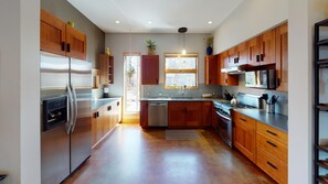 Enjoy cooking and dining in this well-equipped kitchen with a dishwasher, double sink, and gas stove.