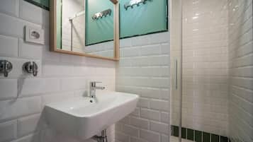 Shower, hair dryer, towels, toilet paper