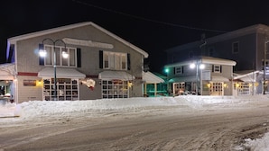 A building with a sign reading "Simnekill Square" and a barber shop. - Binnekill Views- Cozy Apt over looking the Binnekill stream (Margaretville)