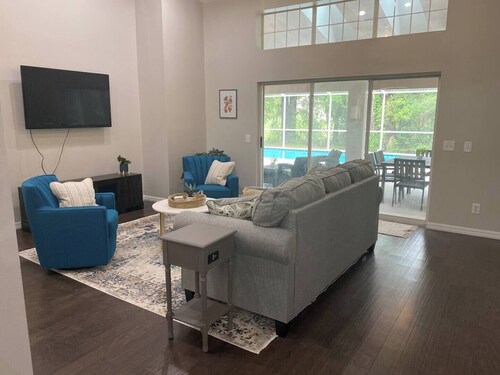 Clean and modern home, sparkling heated pool, near river