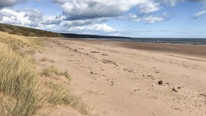 A sandy beach with dunes and a clear sky. - 2 bedroom accommodation in Fettercairn (Fettercairn)