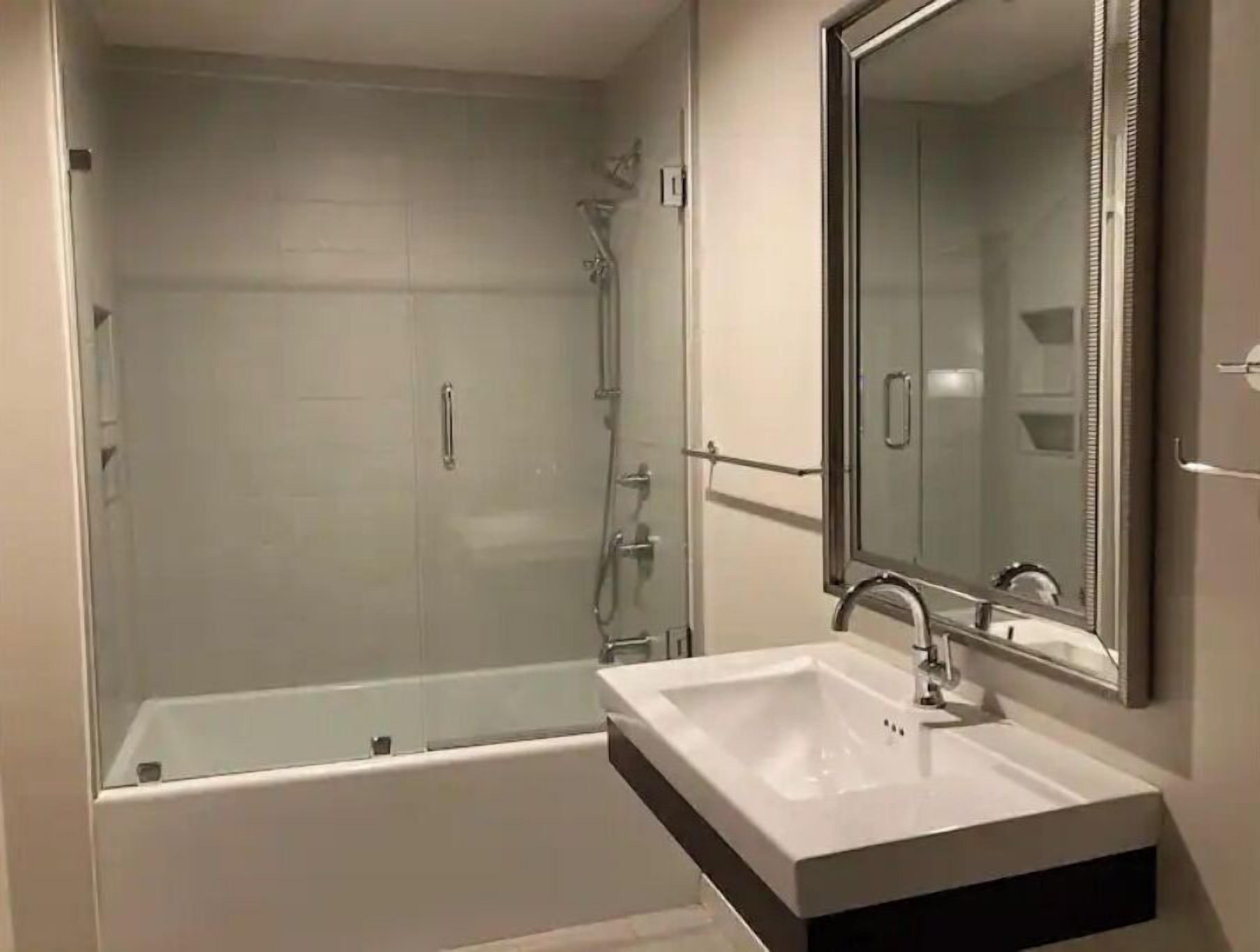 Combined shower/tub, hair dryer, towels, soap