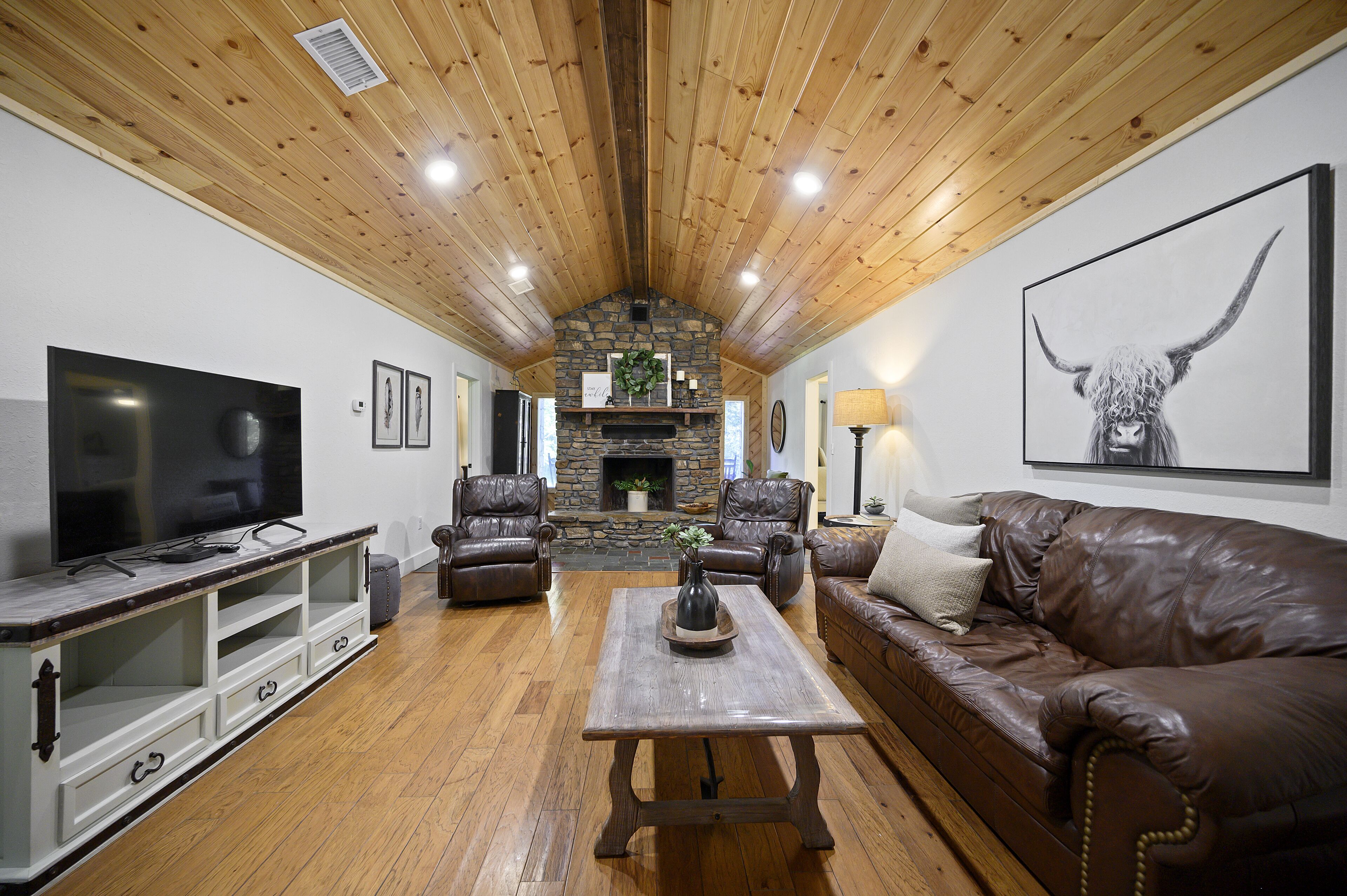 Secluded 4 bedroom farmhouse nestled on 8 acres with large lawn and oak trees. 