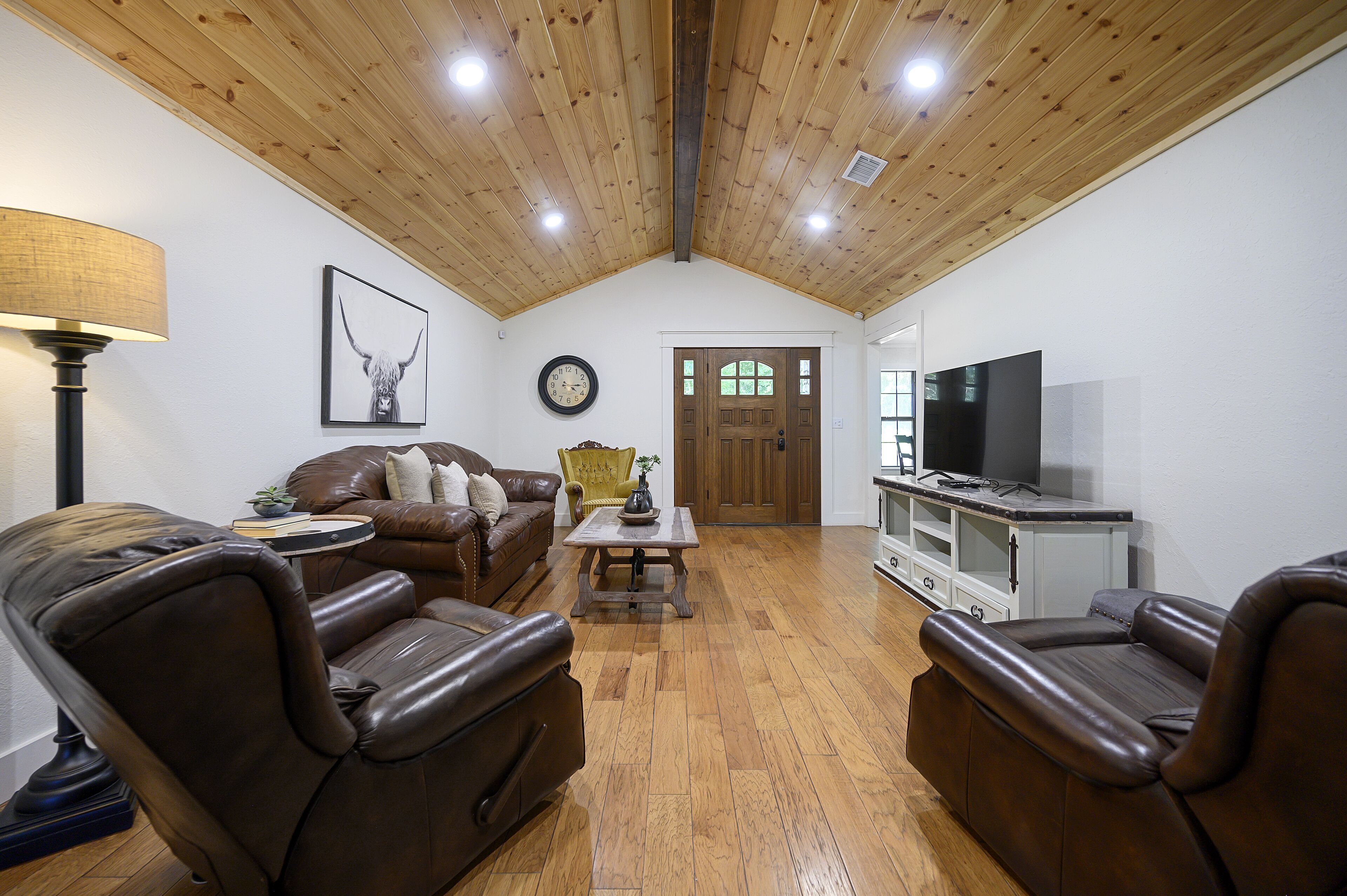 Secluded 4 bedroom farmhouse nestled on 8 acres with large lawn and oak trees. 