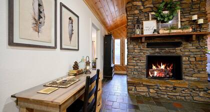 Secluded 4 bedroom farmhouse nestled on 8 acres with large lawn and oak trees.