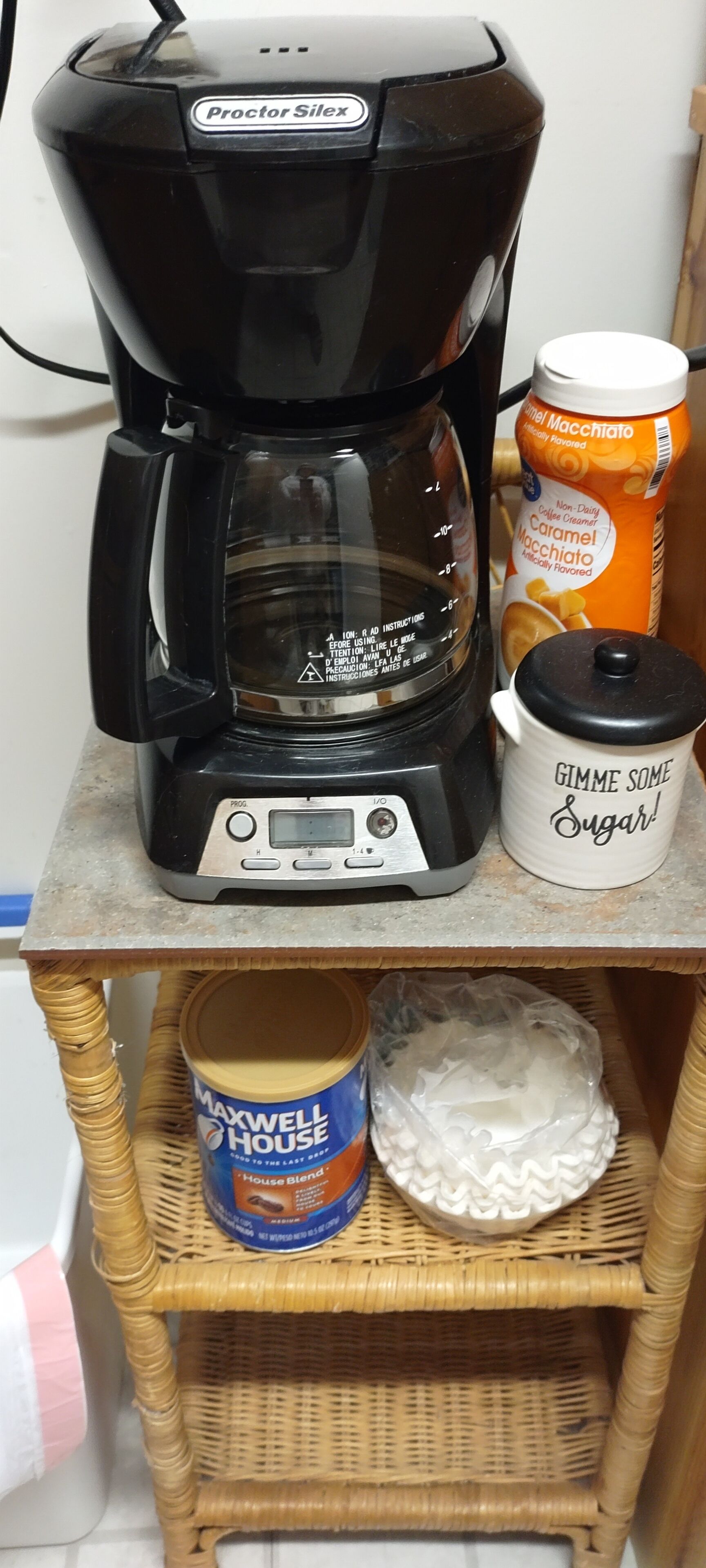 Coffee pot, coffee, cream and sugar for guests
