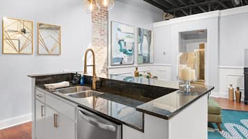 Enjoy cooking in this well-equipped kitchen with a central island, dishwasher, and ample cabinetry.