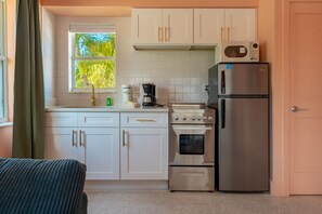 Fridge, microwave, oven, stovetop - 104 · Beach Bliss Mid-Century Modern Apt Steps from Sand (Clearwater)