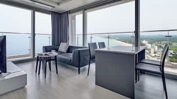Presidential Spa Suite | Living area | 55-inch flat-screen TV with cable channels, TV, heated floors