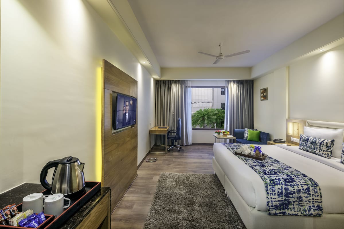 Premium kamer | Luxe beddengoed, een minibar, een kluis op de kamer, geluiddichte muren