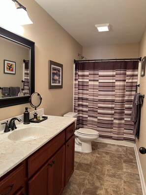 Combined shower/bathtub, hair dryer, towels, soap
