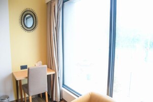 Standard Room | 1 bedroom, in-room safe, desk, iron/ironing board