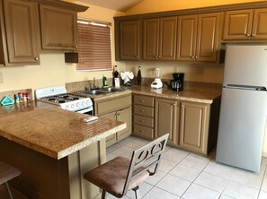 Fridge, coffee/tea maker, cookware/dishes/utensils