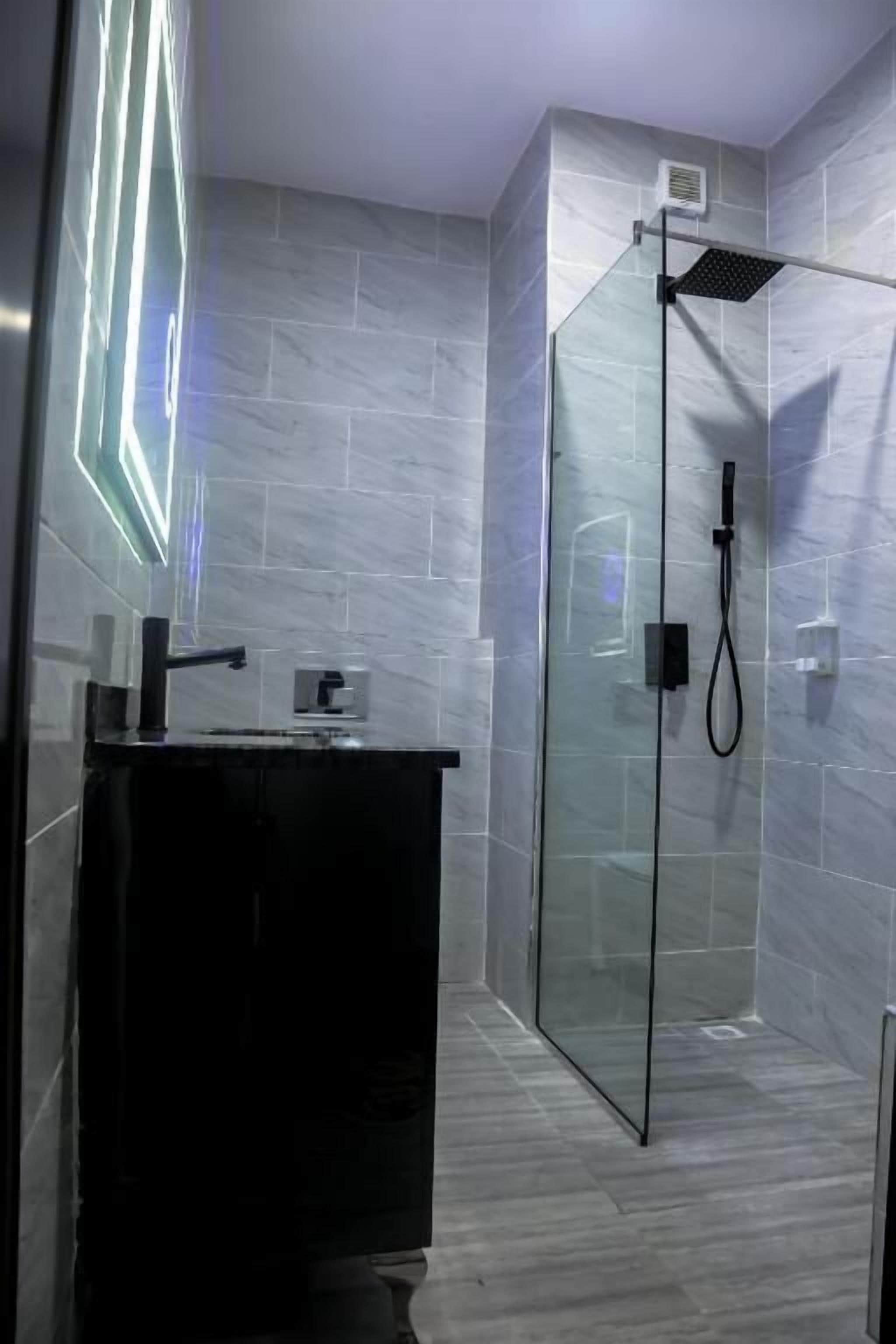 Shower, hydromassage showerhead, designer toiletries, hair dryer