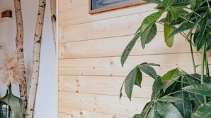 A wooden wall with a chalkboard displaying "Welcome".