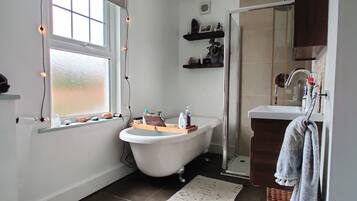 Bathtub, hair dryer, towels, soap