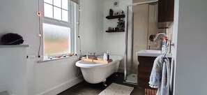 Bathtub, hair dryer, towels, soap