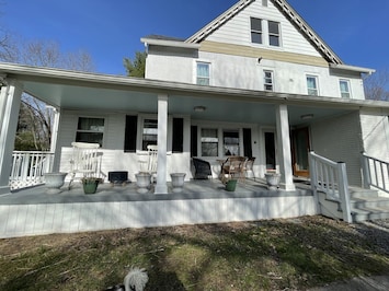 Renovated 7 bedroom farmhouse with front porch for rocking away the day. 