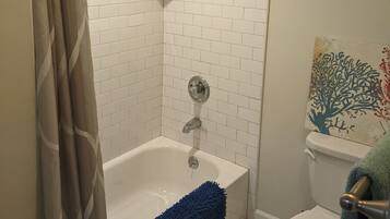 Combined shower/tub, hair dryer, towels, soap