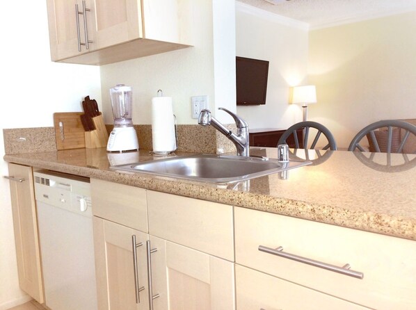 Microwave, dishwasher, coffee/tea maker, cookware/dishes/utensils