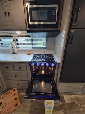 Microwave, coffee/tea maker, cookware/dishes/utensils