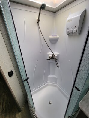 Shower, hair dryer, towels