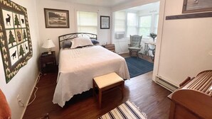 A bedroom with a bed, a chair, a desk, and a ceiling fan. - Lake Luzerne Cottage with Lake Rights 15 Min from Lake George (Lake Luzerne)