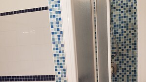 A bathroom with a toilet, bidet, and a shower stall with a glass door. - Beach house 9 places independent with garden and barbecue CIN IT081020C23DP4ZB5R (San Vito Lo Capo)
