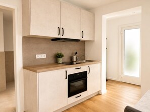 Fridge, microwave, coffee/tea maker, toaster