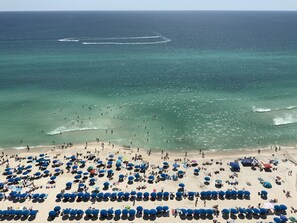 On the beach, sun-loungers
