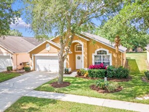 Situated in a quiet suburban neighborhood, this single-story house offers a serene atmosphere.
