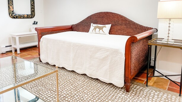 A bedroom with a bed, a nightstand, a mirror, and a window. - Best Apt in Chevy Chase DC Big Sleeps 4-5, 4 blks to Metro (Washington)