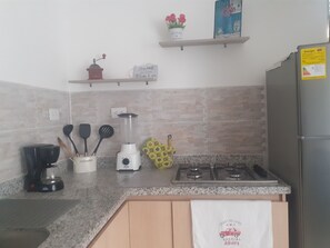 Fridge, oven, stovetop, dining tables