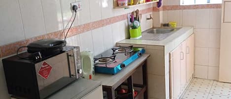 Fridge, electric kettle, cookware/dishes/utensils