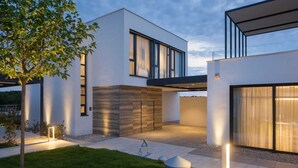 A modern two-story house with large windows, a flat roof, and a minimalist design. - Luxury 5-Star Spa Villa for Up to 12 Guests (Bale)