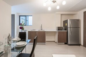 Fridge, microwave, stovetop, cookware/dishes/utensils