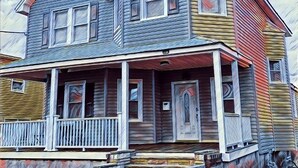 A two-story house with a porch, a chimney, and a stone foundation. - Charming 4bedroom 2nd Floor Beach House - 1.5 blocks to the beach (Long Branch)