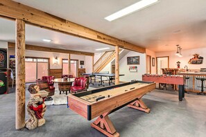 A spacious room with a foosball table, a dartboard, and a billiards table. - Family Game Room: Spacious Overgaard Cabin (Overgaard)
