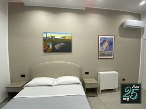 1 dormitorio, tabla de planchar con plancha, cuna de viaje y wifi gratis