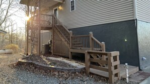 A two-story house with a wooden staircase leading to a covered porch. - Murphy Sunset View--Perfect Getaway Location!! (Murphy)