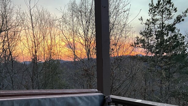 A hot tub with a view of a sunset and trees. - Murphy Sunset View--Perfect Getaway Location!! (Murphy)