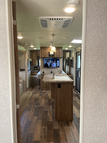 Fridge, microwave, oven, stovetop. Charming Camper Oasis in Miami