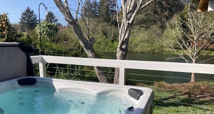 Riverfront Cottage with Hot Tub 1/4 mi from Beach