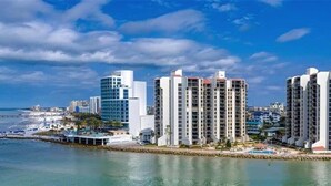 A coastal cityscape with high-rise buildings, a beach, and a marina. - Gorgeous 2/2 condo with fantastic views 1402 (Clearwater)