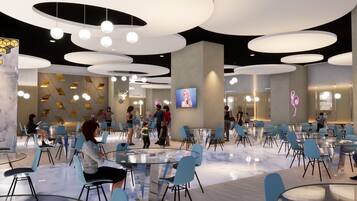 A modern interior with round tables and chairs, a central pillar, and a neon sign.