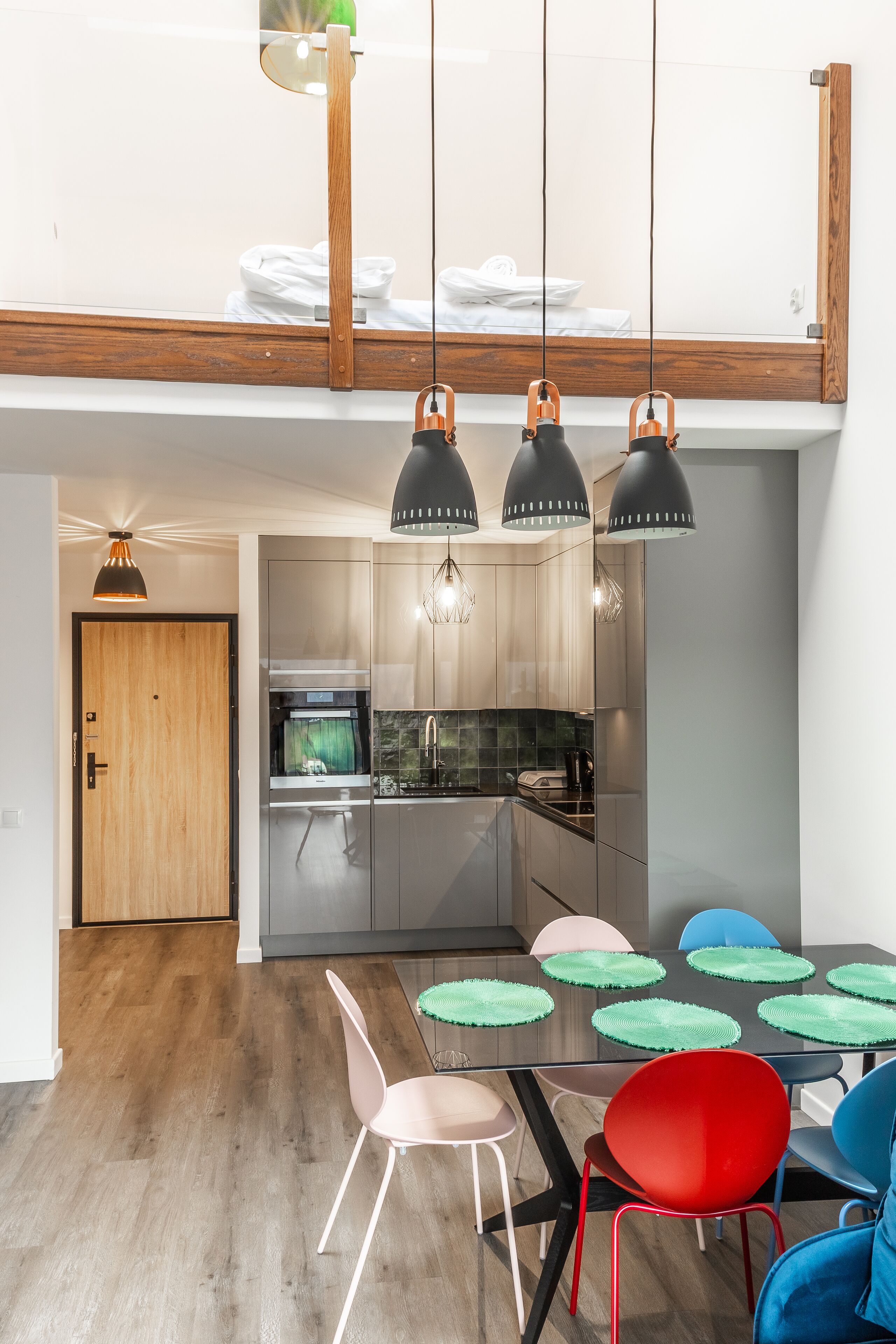 A modern kitchen with a dining area.