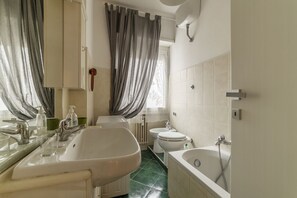 Bathtub, hair dryer, bidet