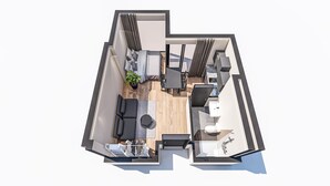 A modern apartment layout with a living area, dining space, and a small kitchen.